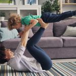 a woman and a child playing on the floor
