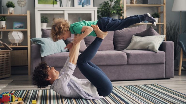 a woman and a child playing on the floor